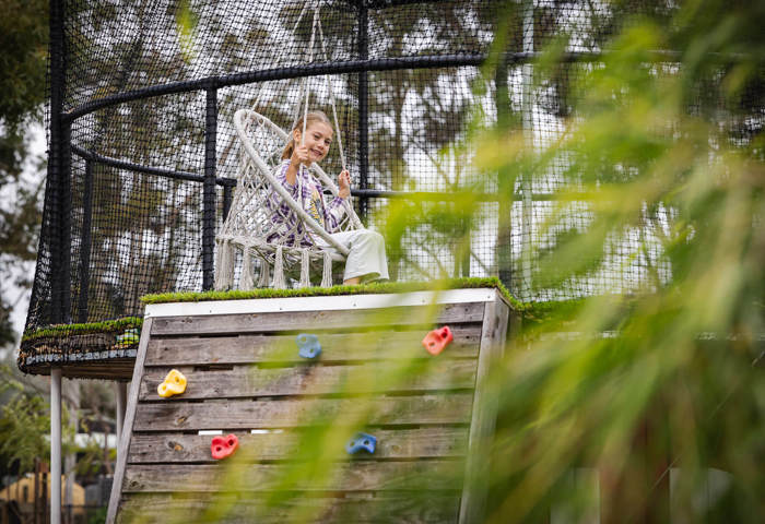 Girl On Swing At Cubby Cafe